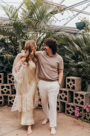 couple walking in greenhouse