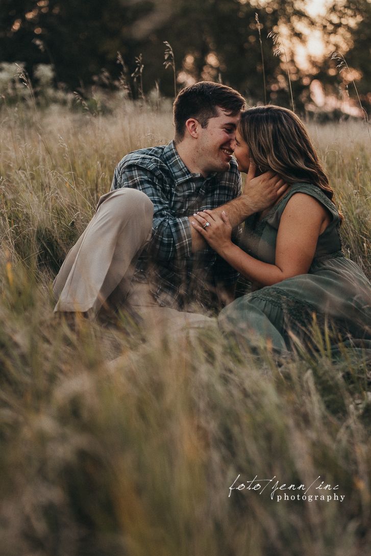 Couple sitting in grass, Cedar Rapids, IA