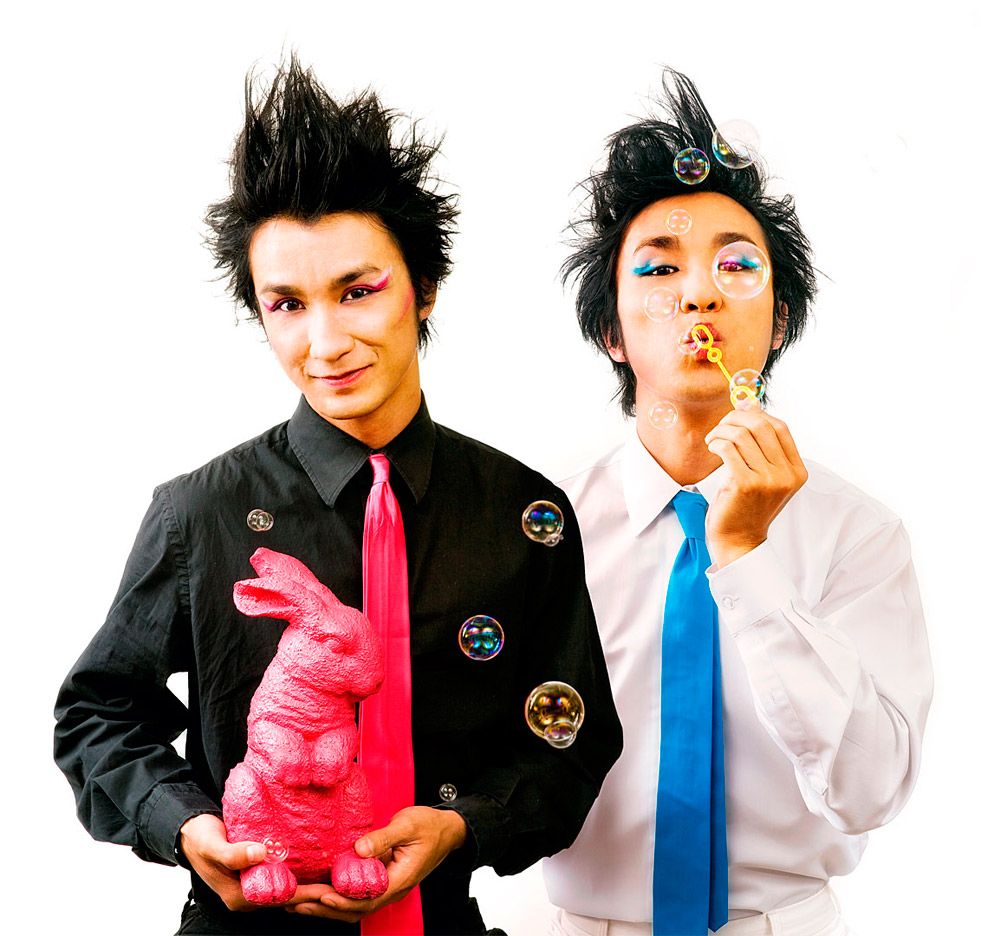 Two figures in black and white attire pose playfully with pink and blue balloons in a series of candid shots.