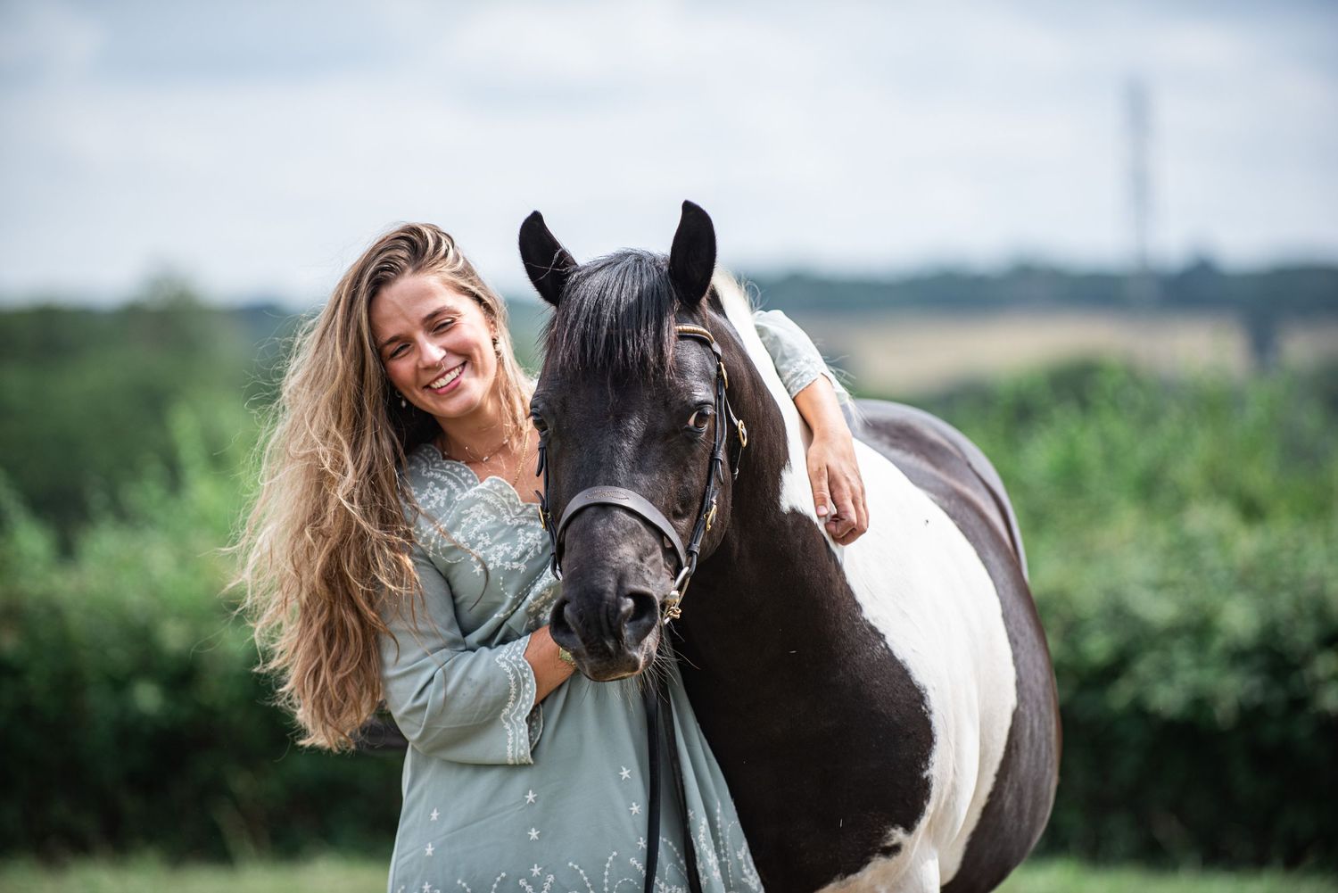 Show pony breeder, Mollie Sibthorpe from Reevesgate Coloured Ponies with pony on family farm during winter equine portrait session