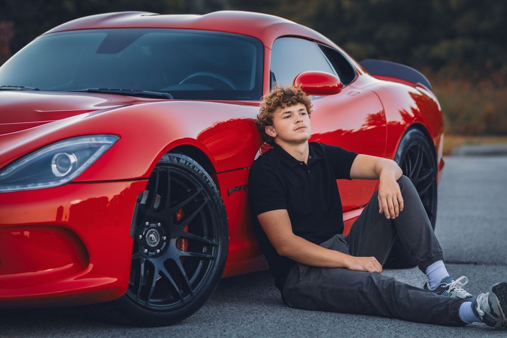 A red sports car is showcased in a series of connected lifestyle shots on a paved road.