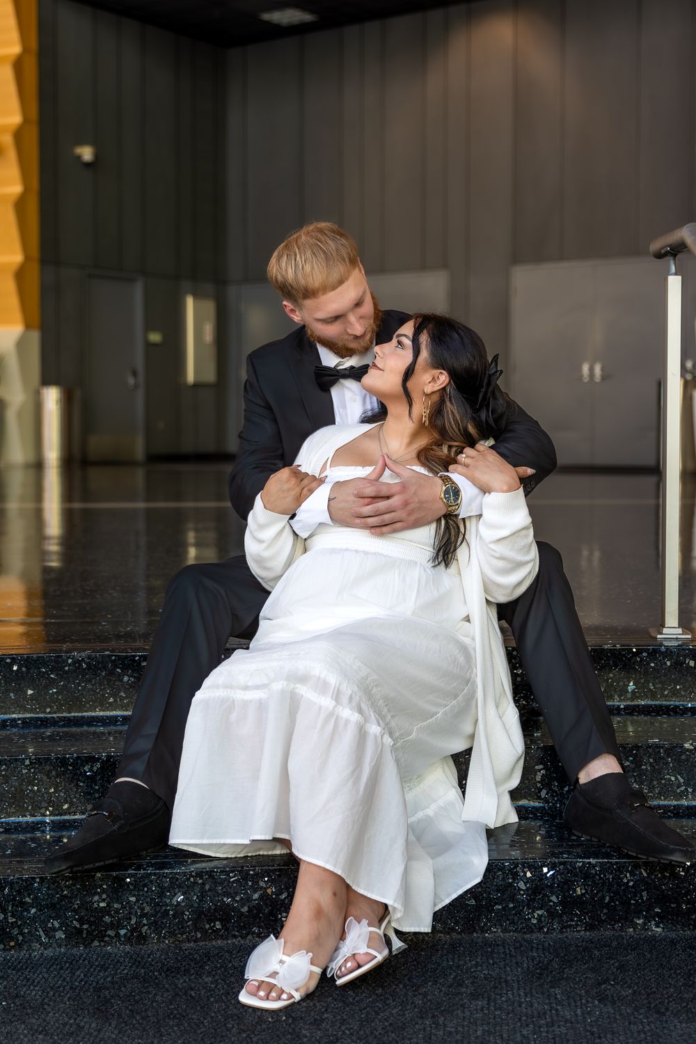 A sequence of intimate wedding photos with the couple seated and sharing tender moments.