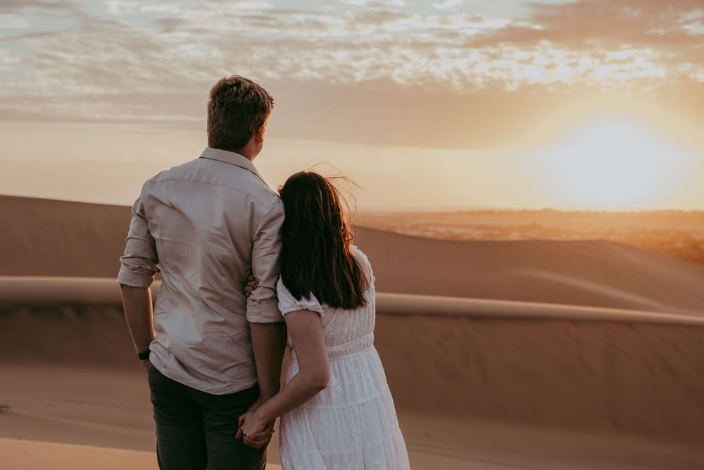 a couple celebrating their engagement in the Namib dunes