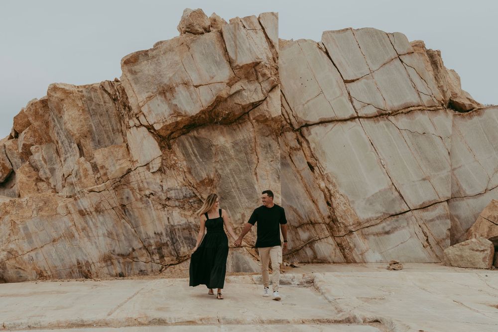 a couple enjoying their shoot with a granite backdrop, Namibia