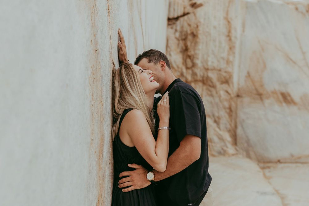 a couple enjoying their shoot with a granite backdrop, Namibia