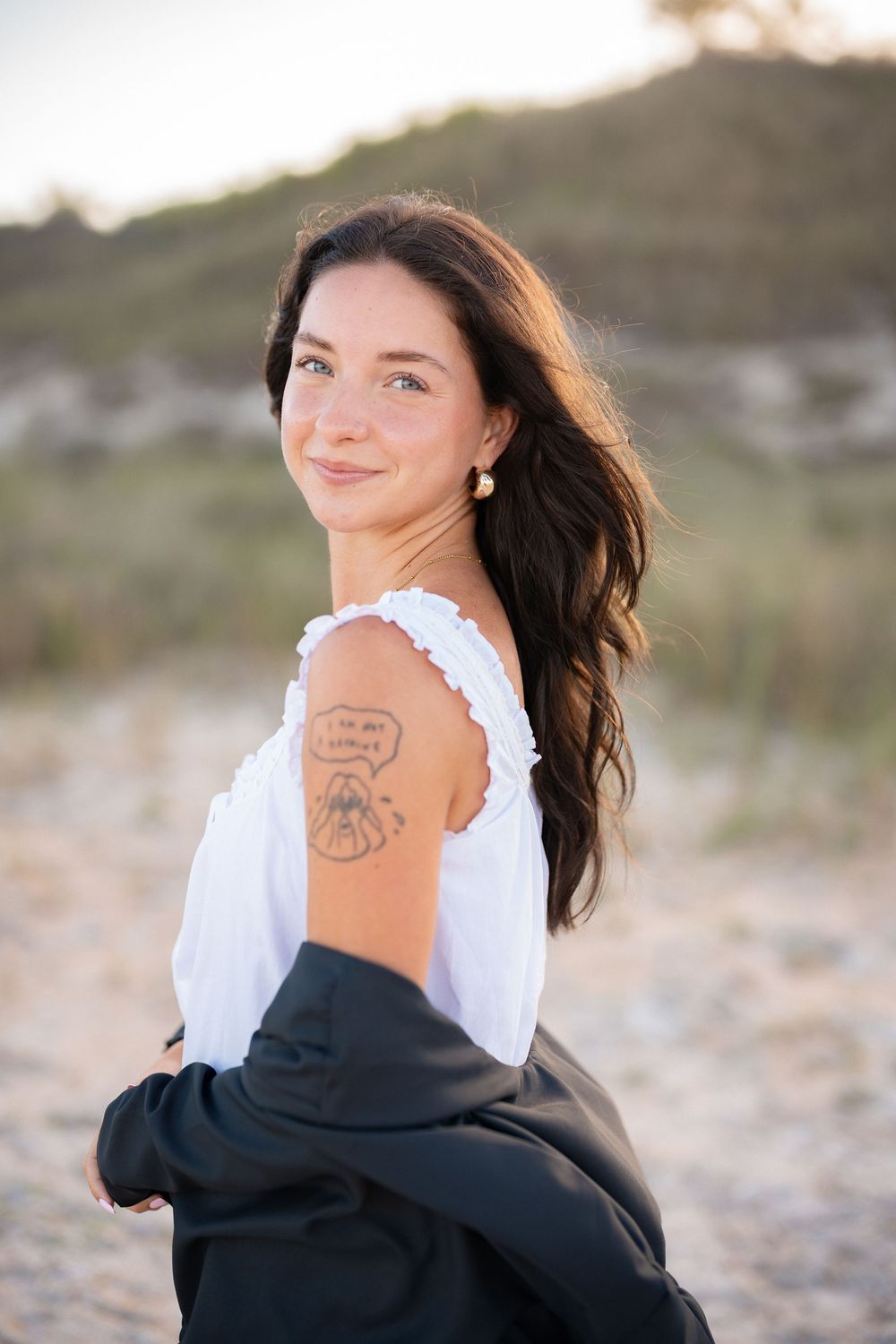 Graduate celebrating during a graduation portrait session