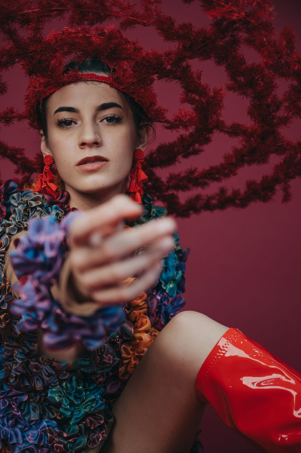 Fashion portrait with floral print and red latex against dramatic red background. SIX84 Photography, Portrait Photography, Sydney