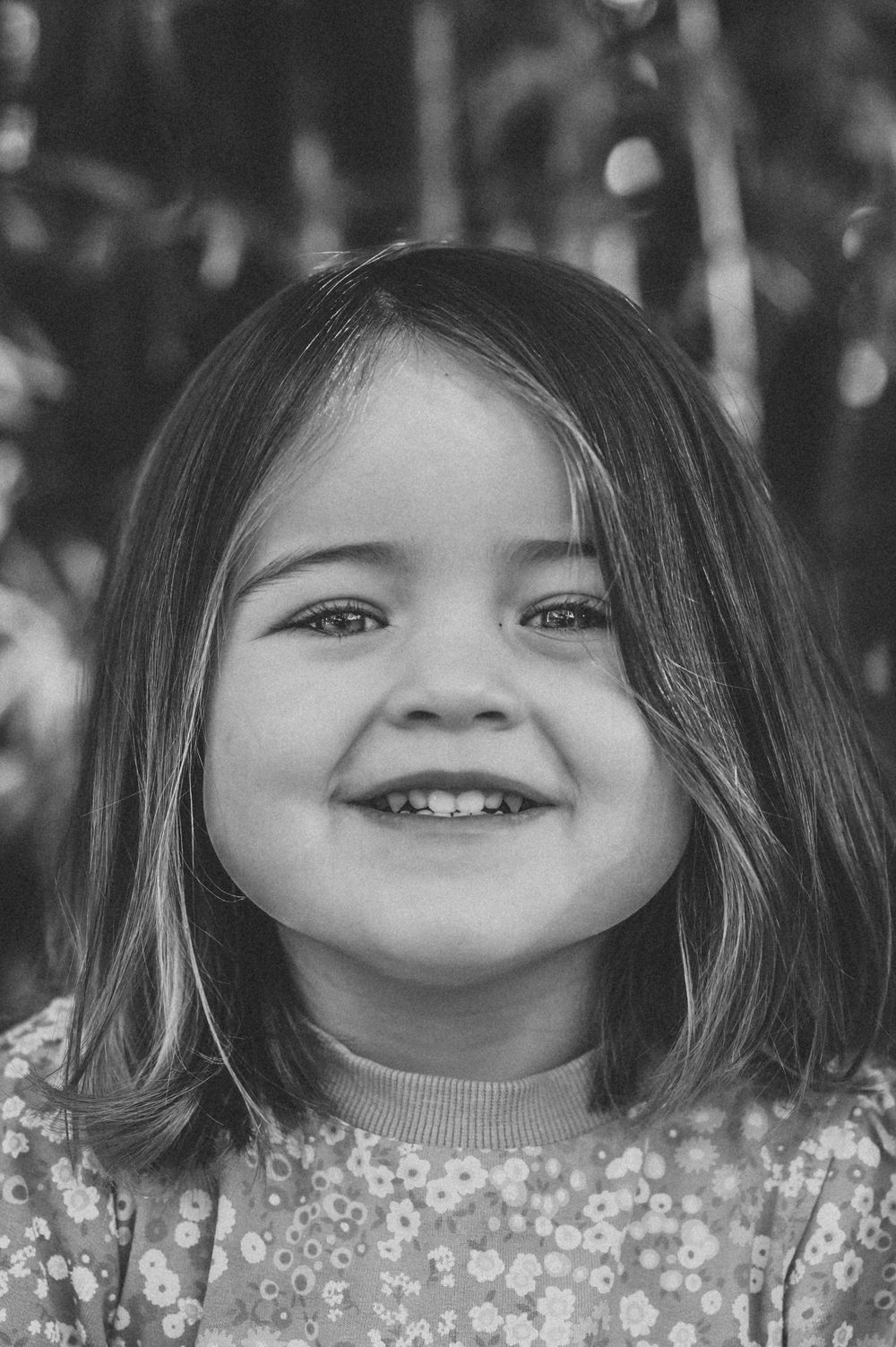 A black and white portrait showing joy and innocence. SIX84 Photography, Event Photography, Sydney