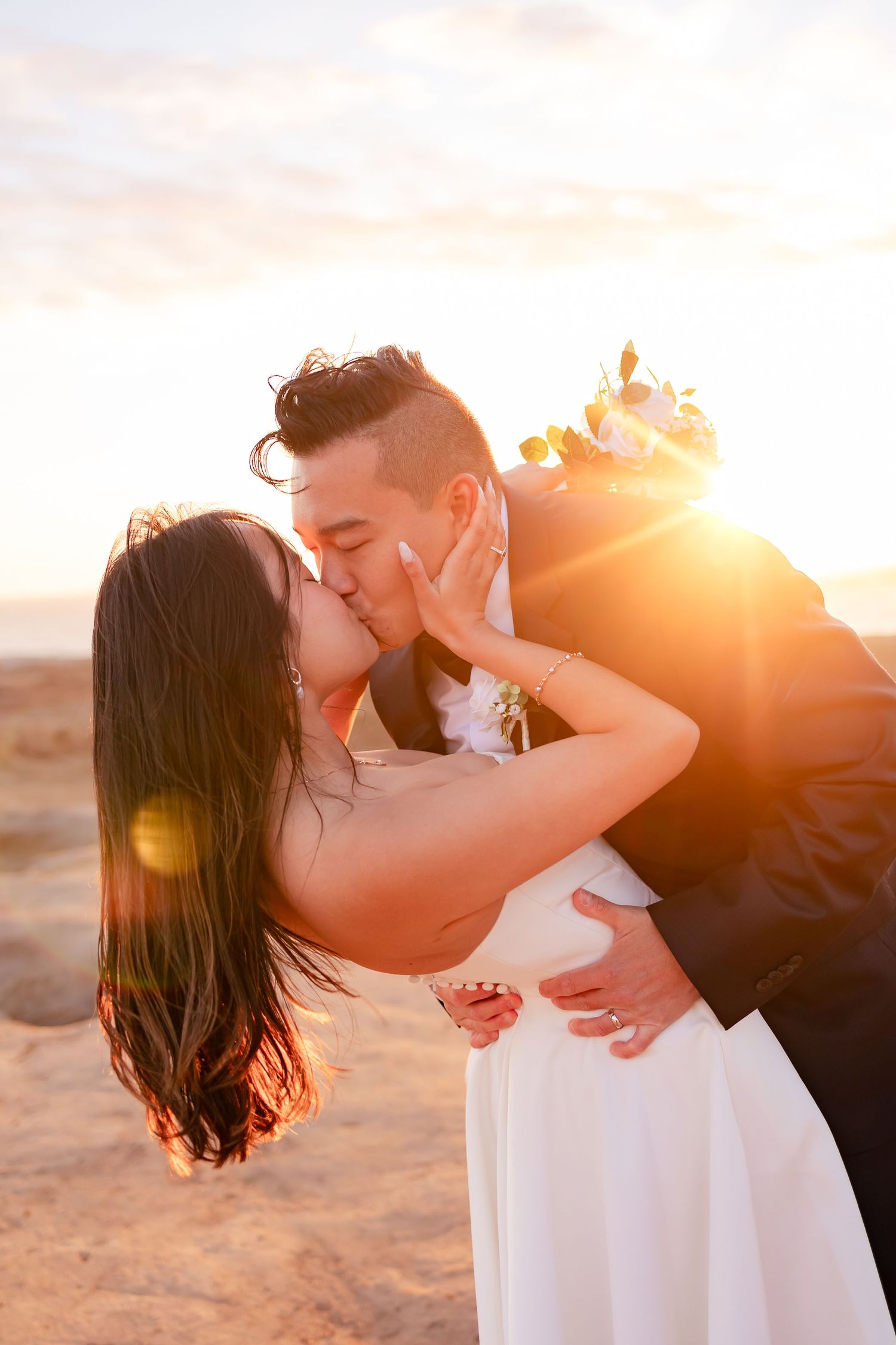 Taylor Carpenter Photography captures bride and groom sharing a golden hour kiss at Otter Point  Recreational Park