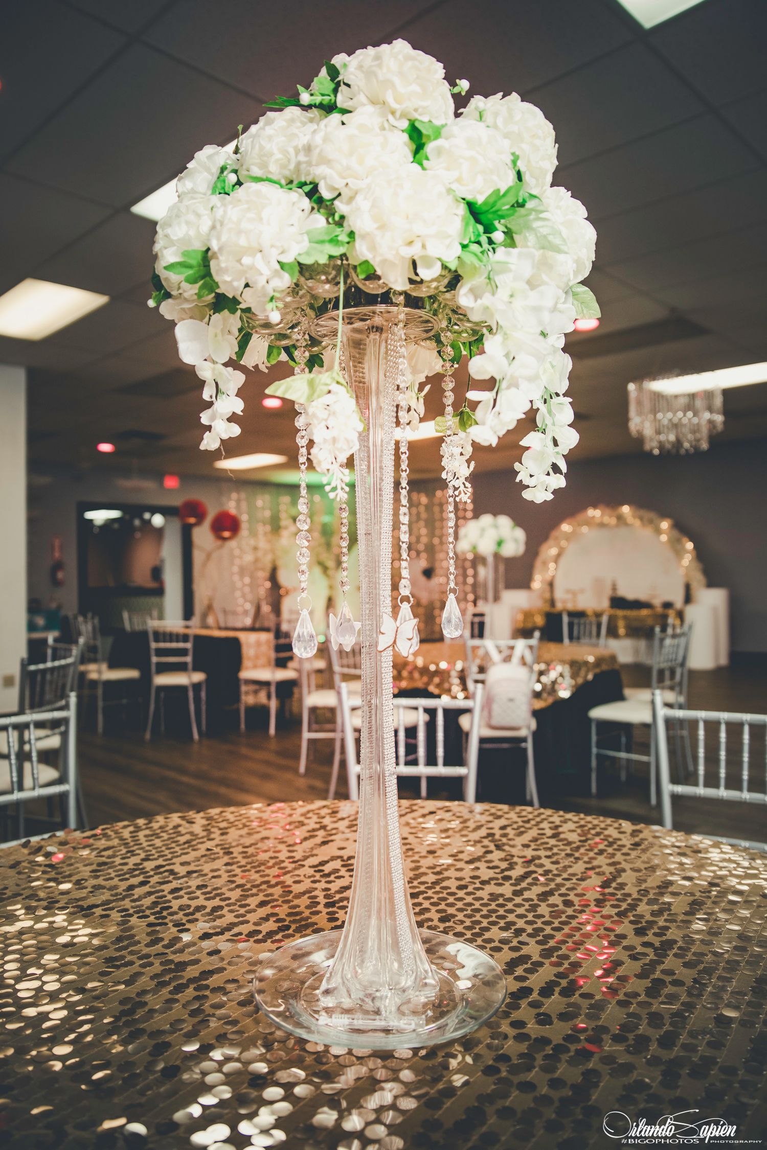 Wedding preparation scene with elegant white dresses and jewelry.