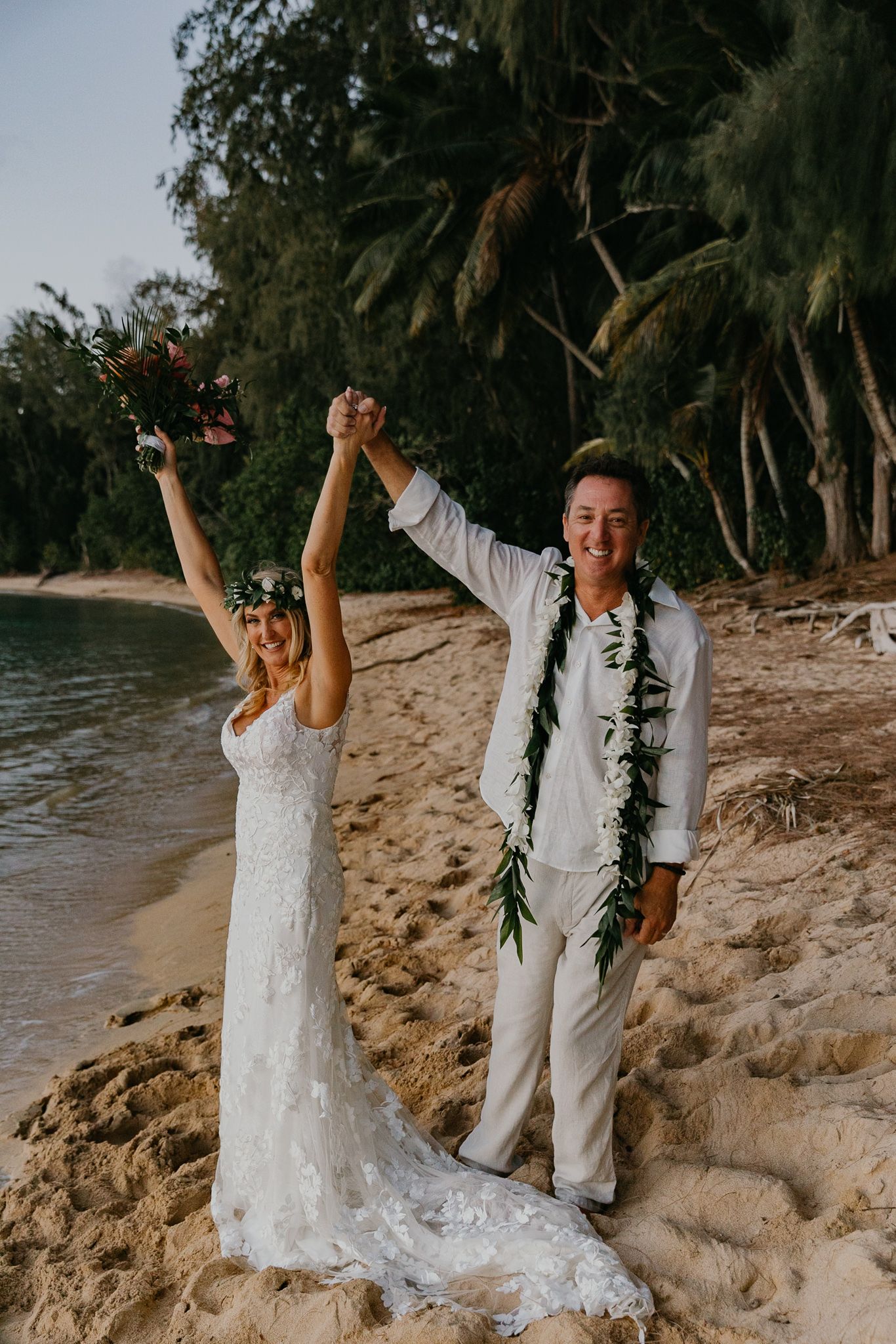 Orlando luxury wedding photographer two lovers excited they just got married on the beach.