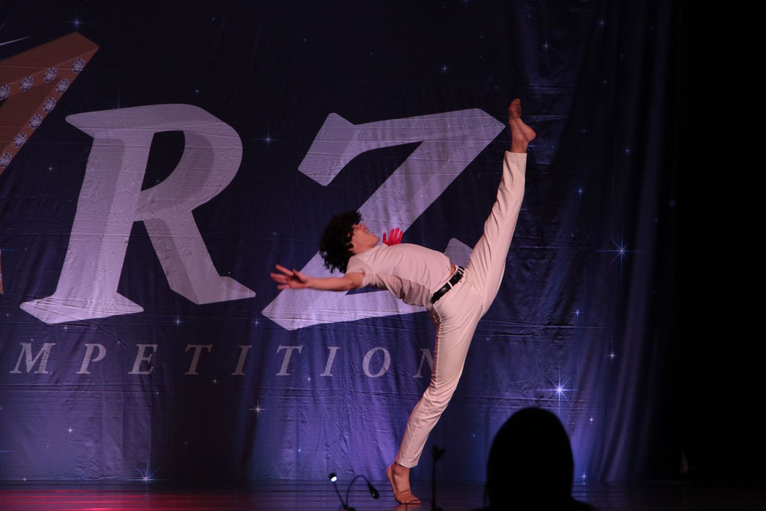 Dancer performing layout in solo