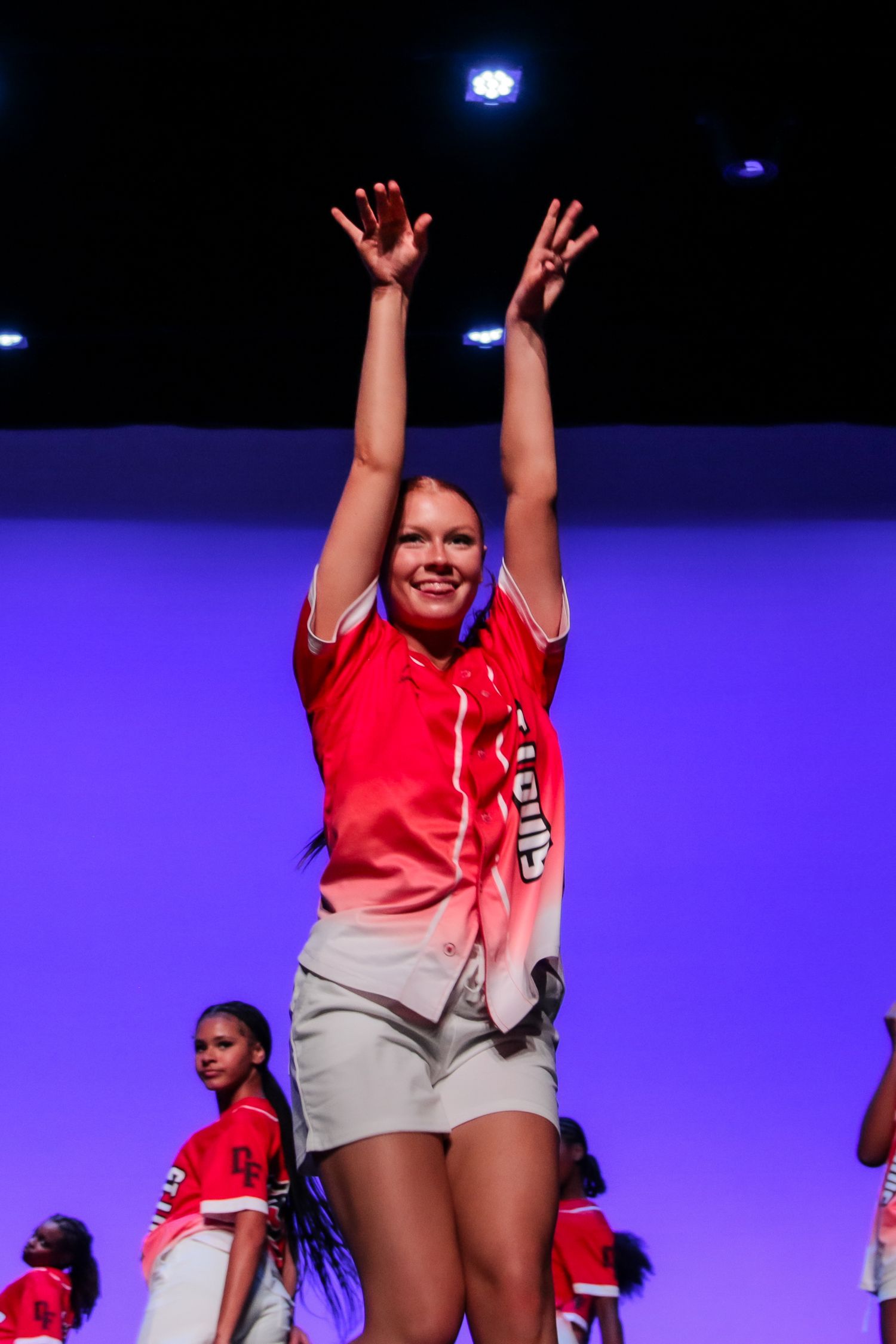 Dancer performing hip hop routine at recital