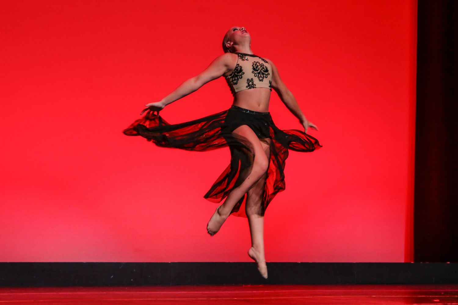 Dancer jumping during solo performance