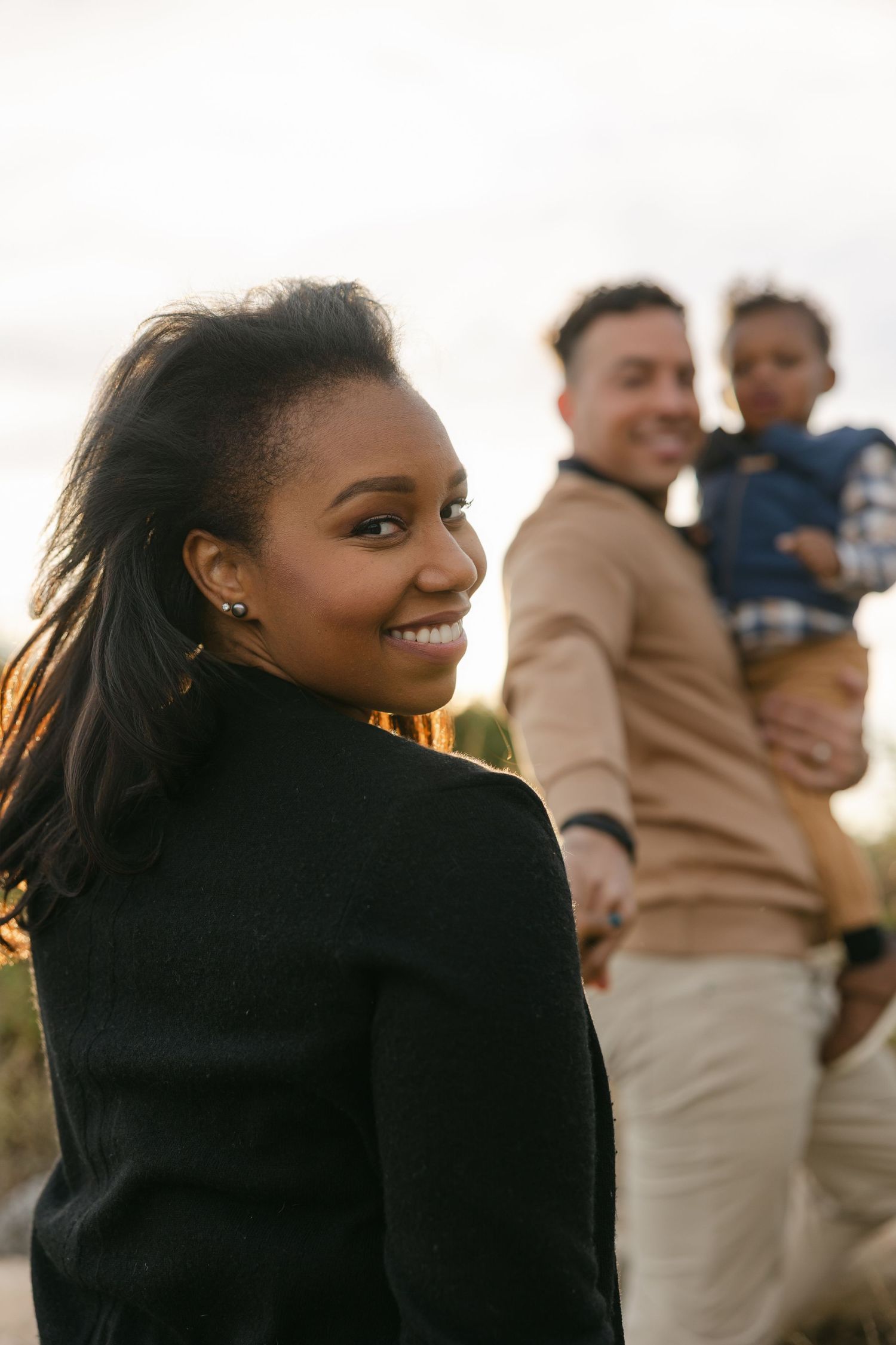 A series of candid outdoor portraits showing joyful expressions at sunset against a soft blurred background | Connecticut Family Photo