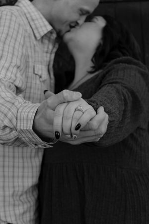 Black and white close-up shots of hands holding and interacting.