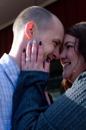 A romantic close-up sequence showing a couple sharing tender moments and embracing.