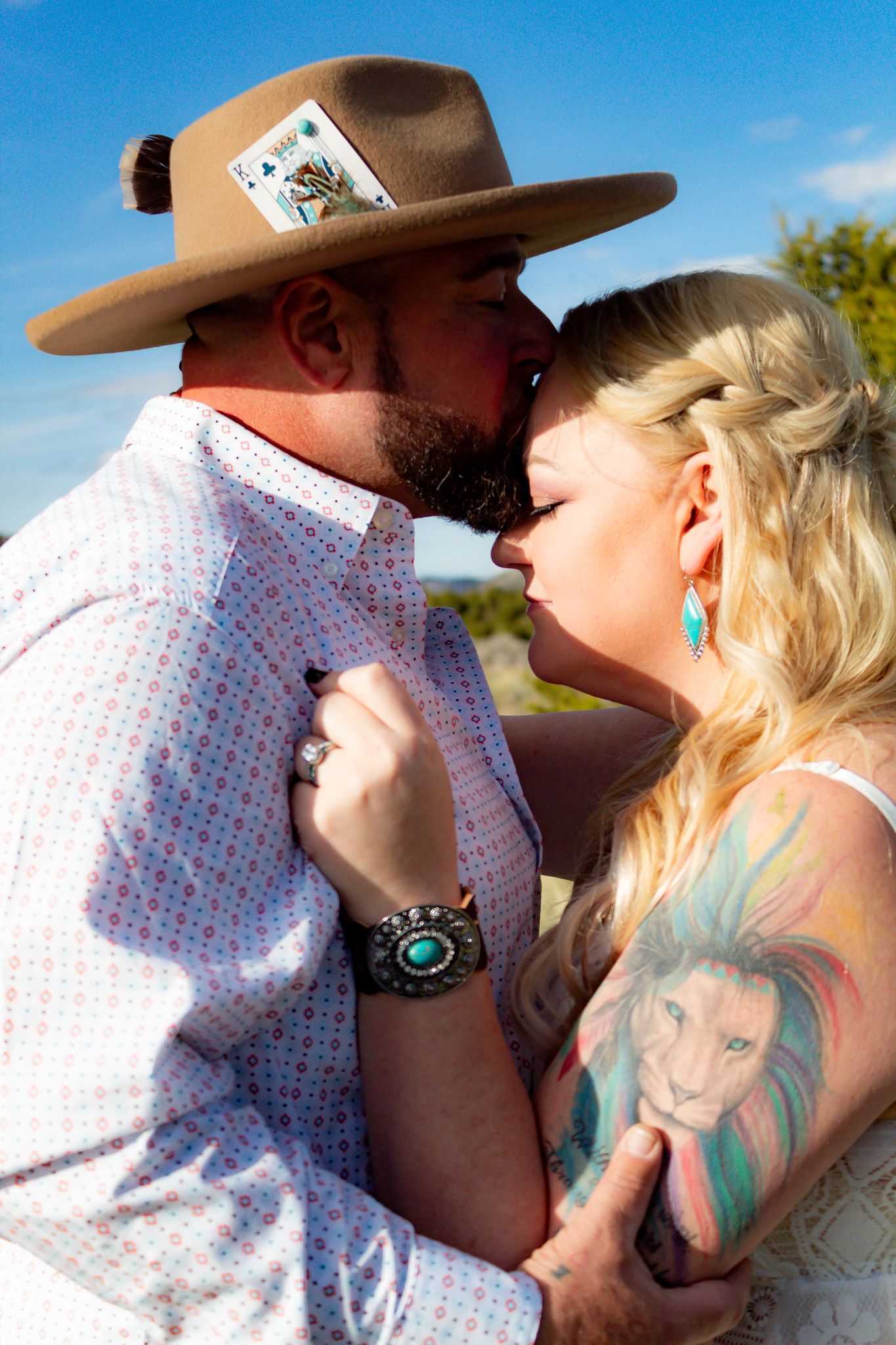 Romantic western-themed photo sequence showing a couple in close embrace against a blue sky backdrop.