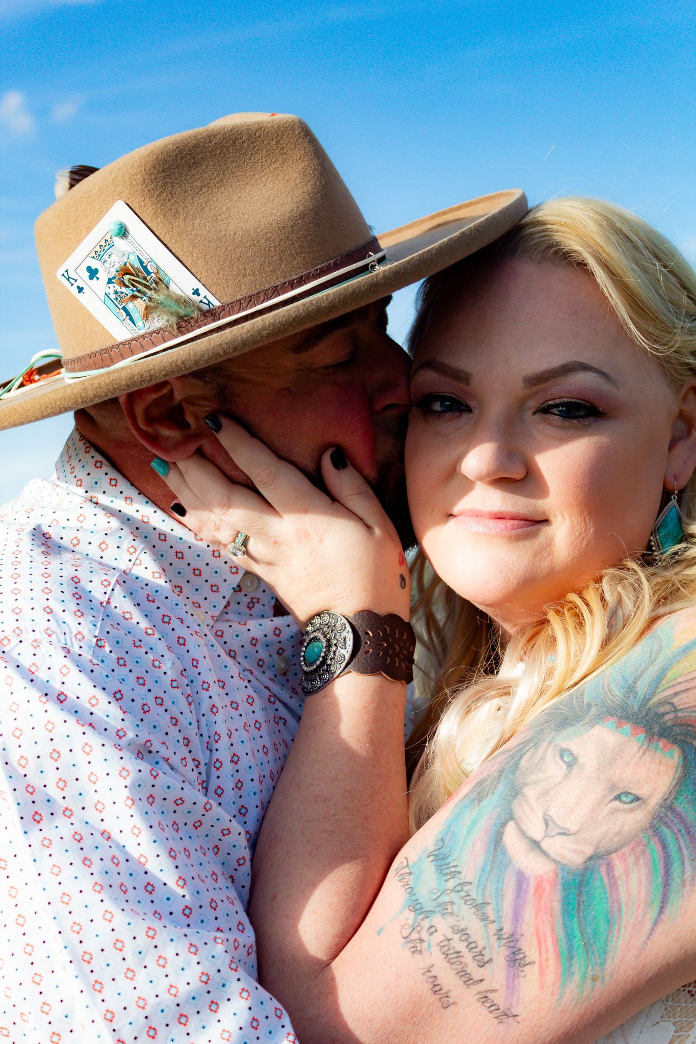 Close-up series of romantic moments between a couple wearing western attire in natural sunlight.