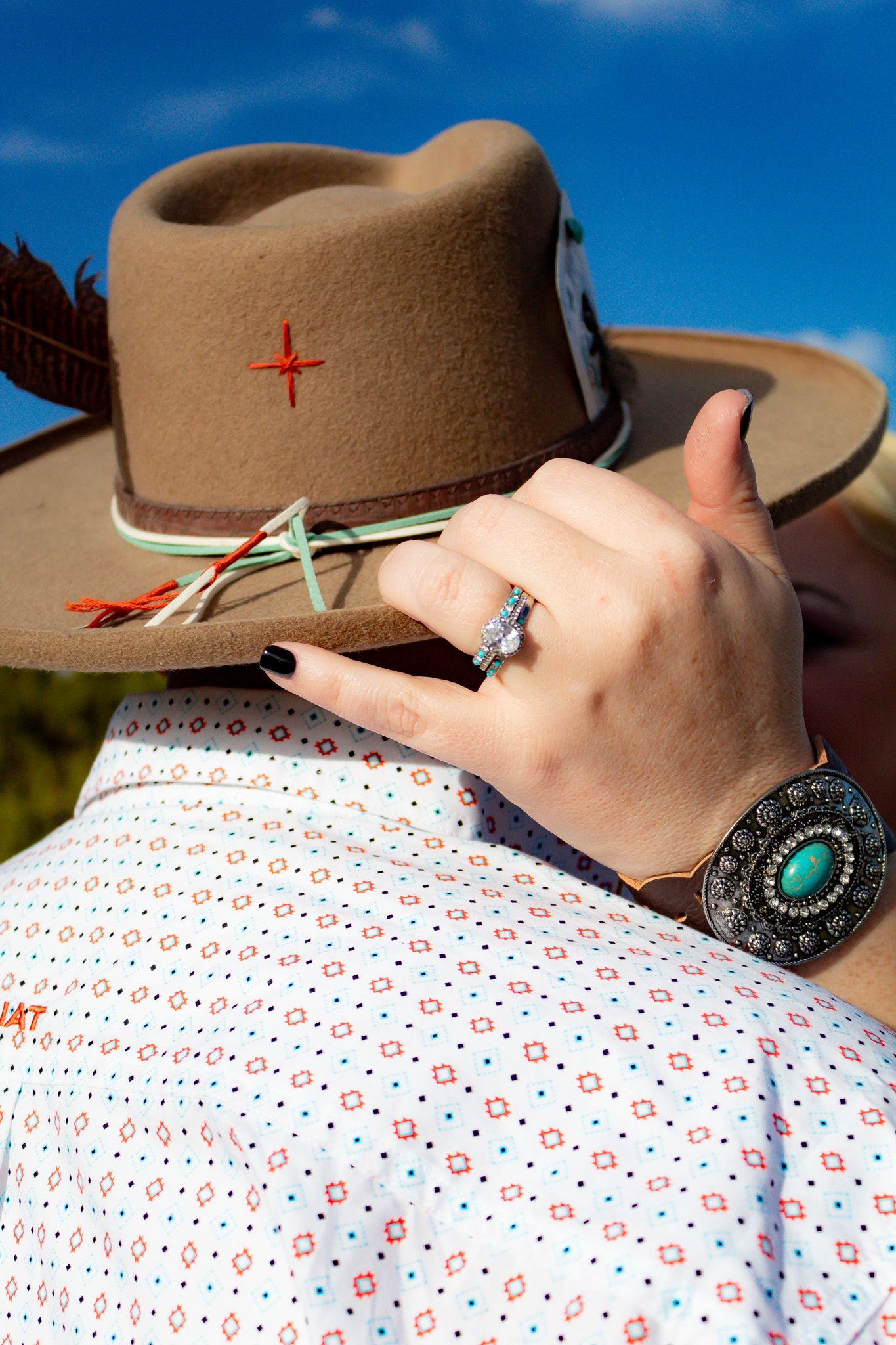Detail shots of western wear including a brown cowboy hat and polka dot shirt with turquoise jewelry.