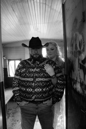 Black and white photo series showing two people in matching patterned sweaters indoors.