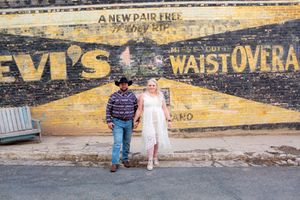 Vintage wall with faded advertising text and signage visible in yellow tones.