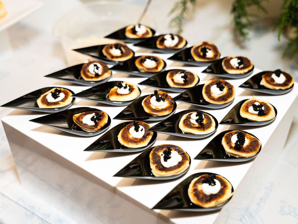 Progression of plating chocolate desserts on white plates with elegant dark garnishes and cream swirls.