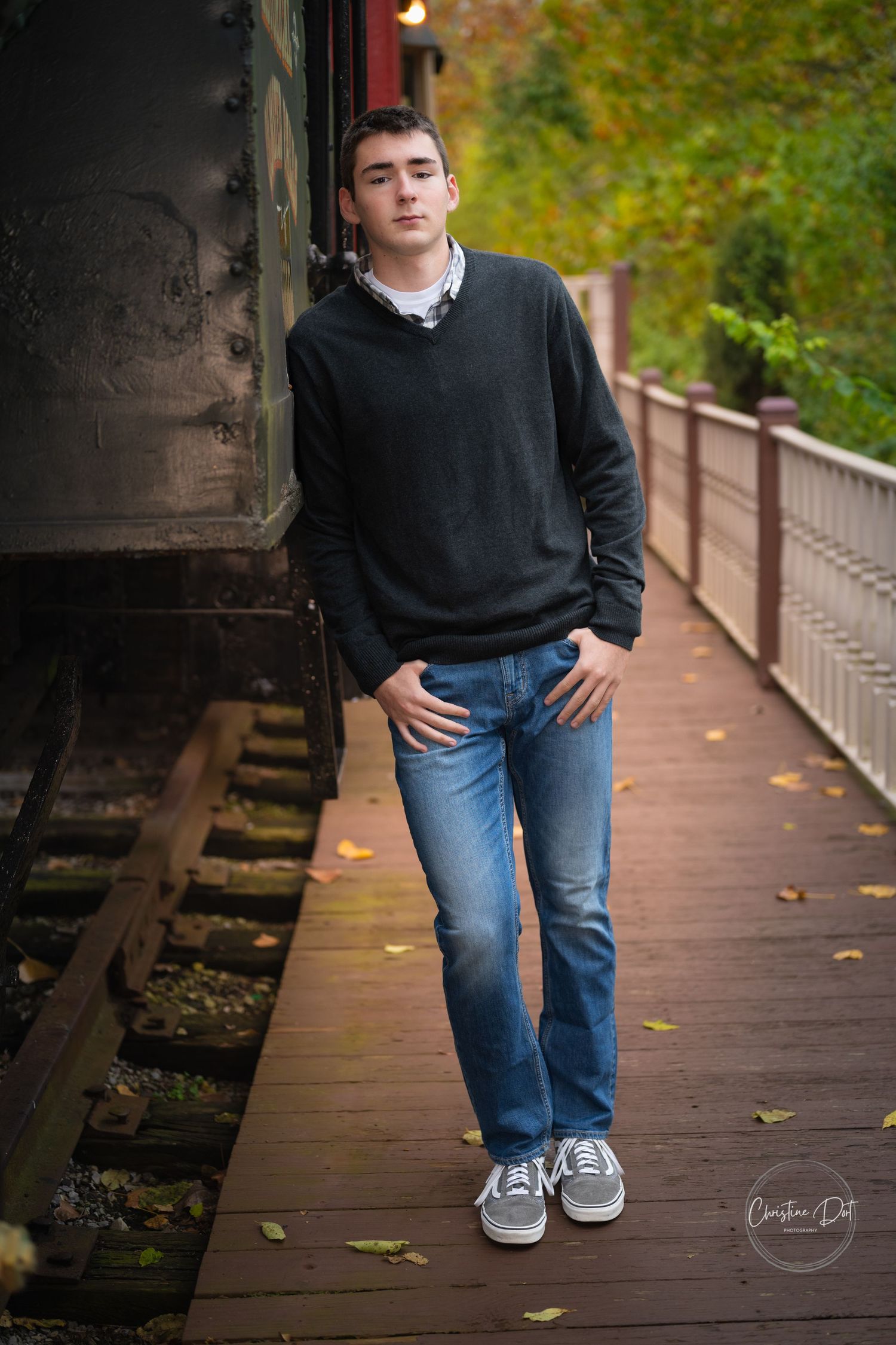 A series of cropped photos showing jeans and sneakers on a wooden boardwalk during autumn.
