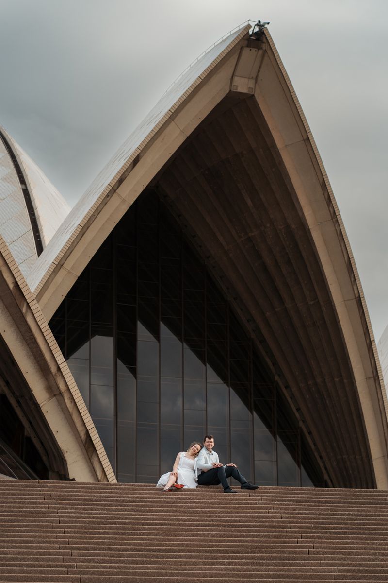 A series of architectural photos showing people sitting on the iconic steps of the Sydney Opera House at different angles engagement photos