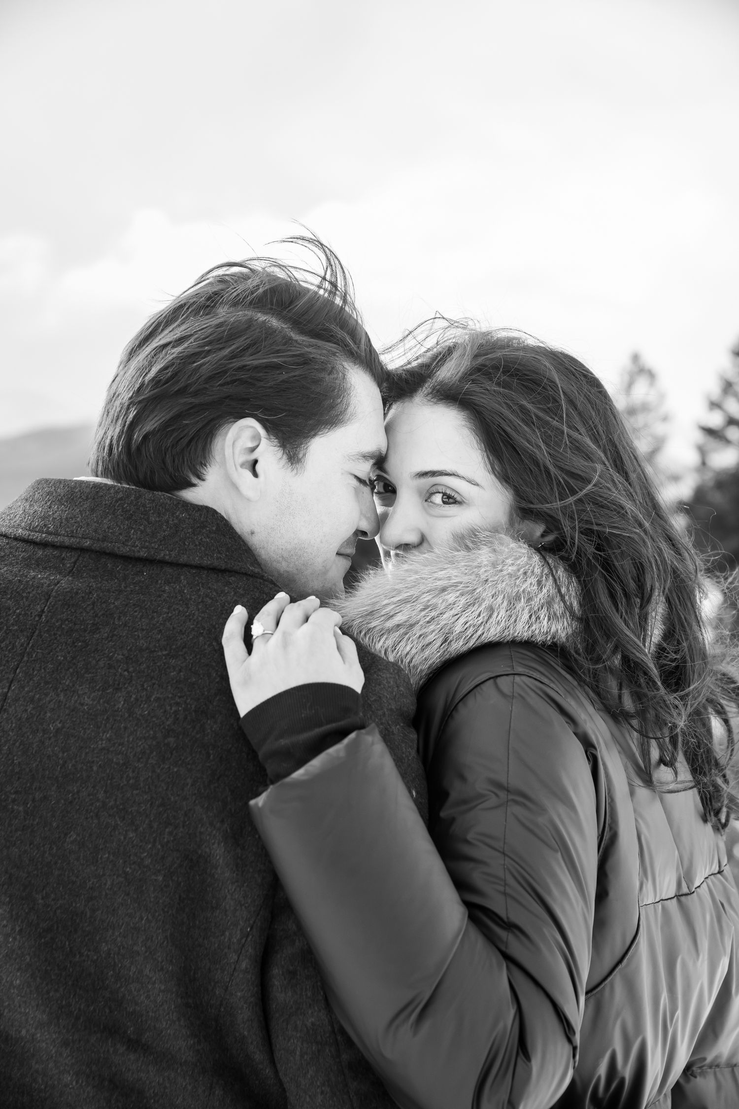 Moody black and white photo of a cute couple during winter engagement photo session in Breckenridge Colorado.