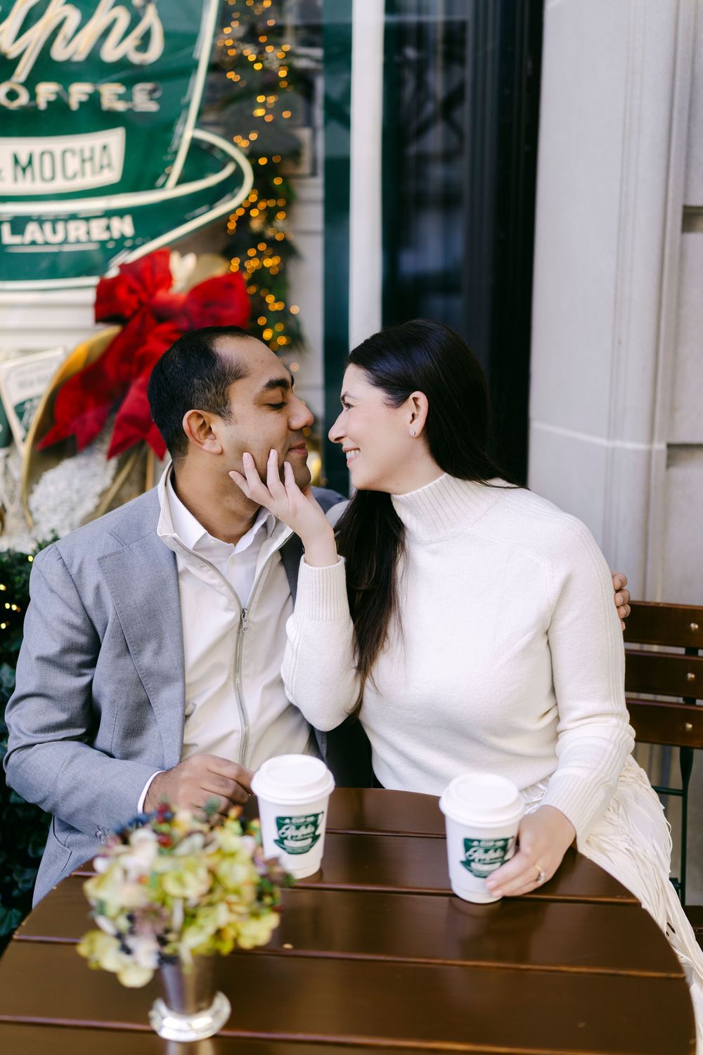 A romantic couple shares intimate moments at a coffee shop with holiday decorations in three progressive photos.