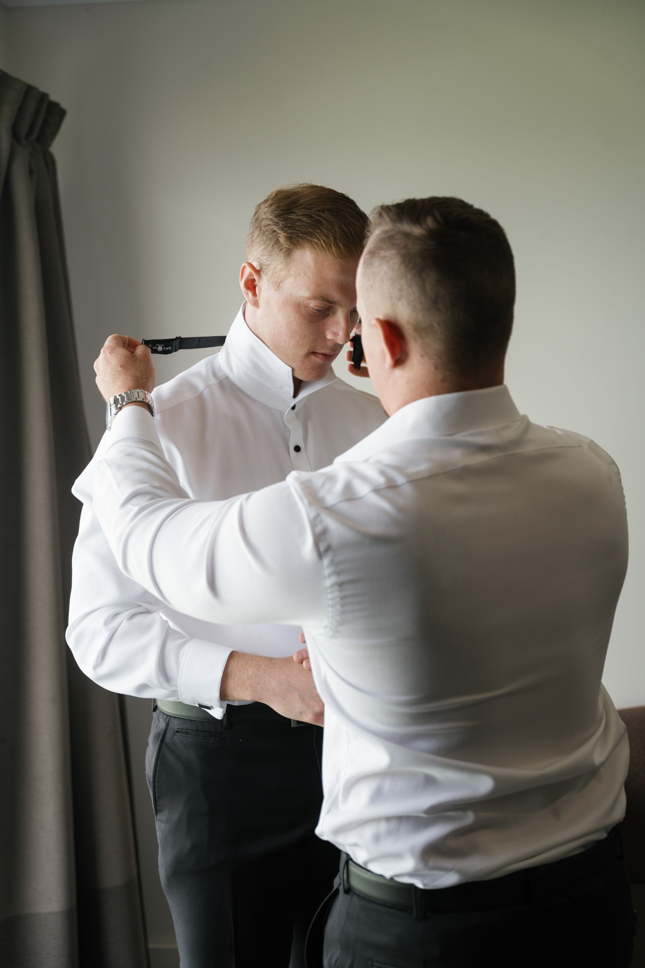 Two people in white dress shirts demonstrate martial arts or self-defense moves in a sequence of training photos.