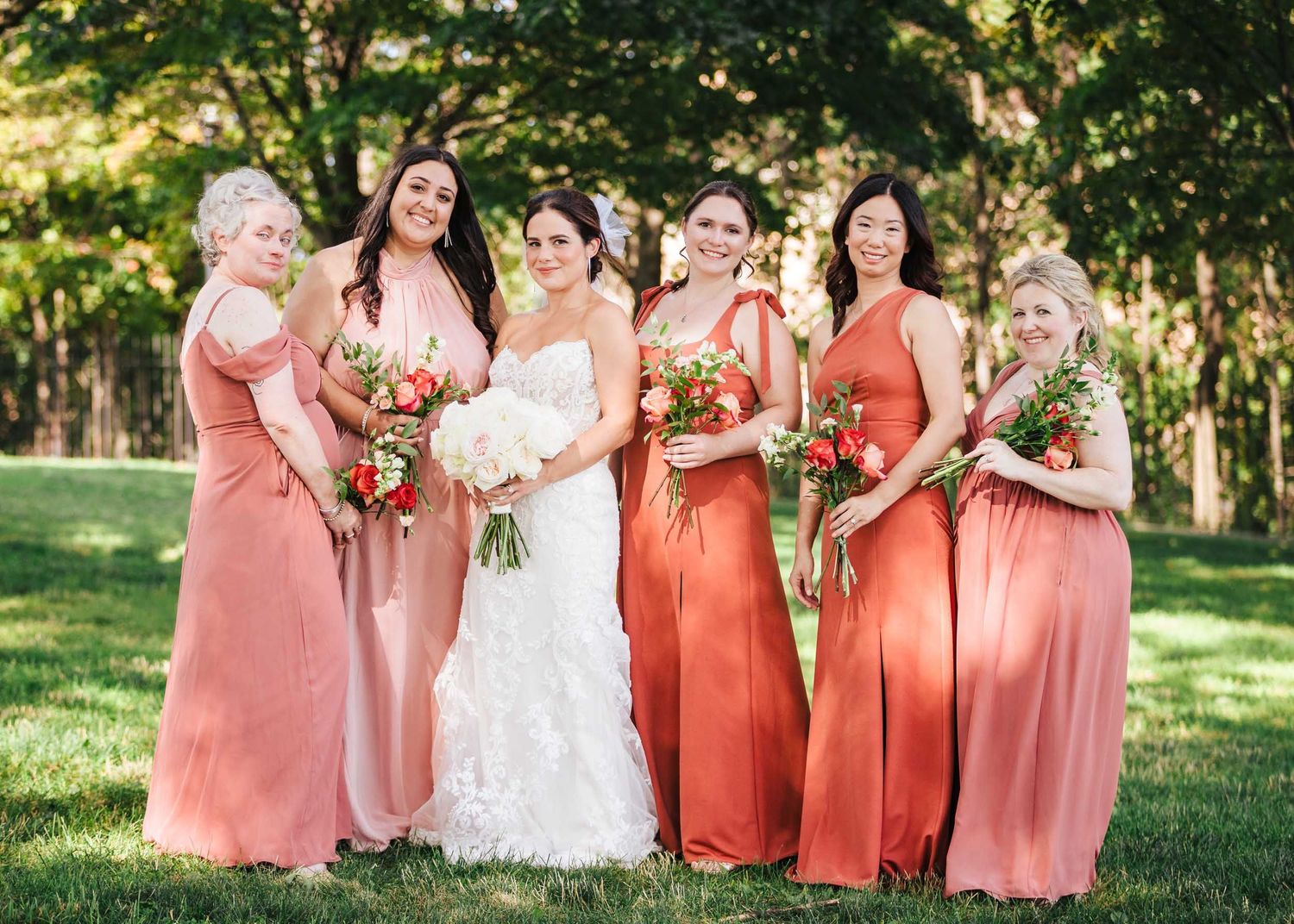 Bride and bridesmaids portrait during wedding photos at Dorchester Heights park in Boston