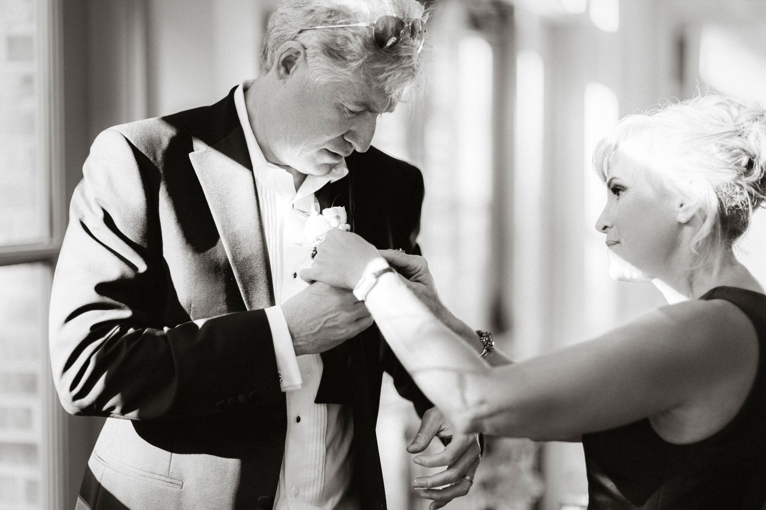 A black and white photo montage shows a couple in formal attire dancing together in different poses.