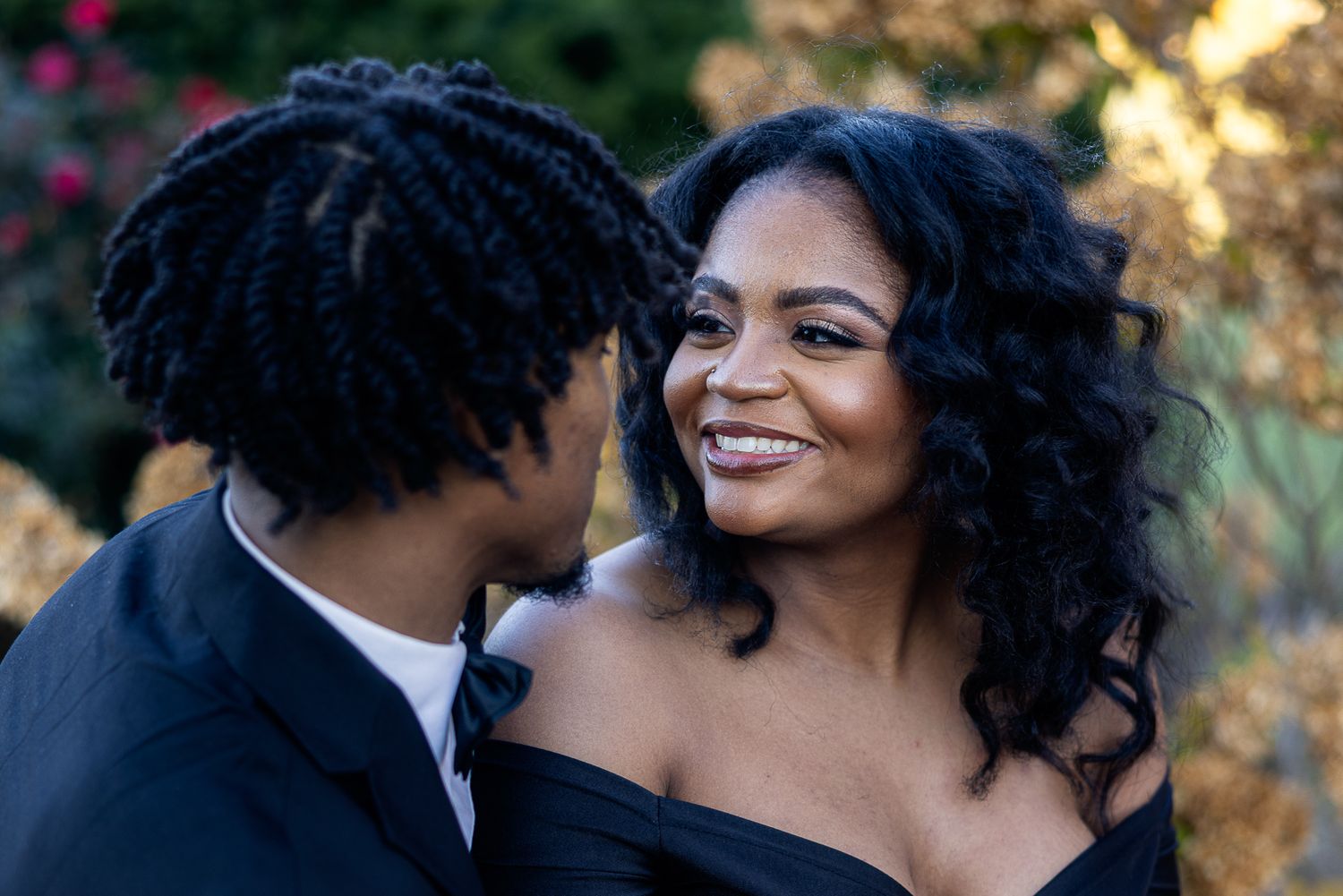 Frederick Maryland Wedding Photographer   - Romantic couple in formal black attire share intimate moment outdoors.