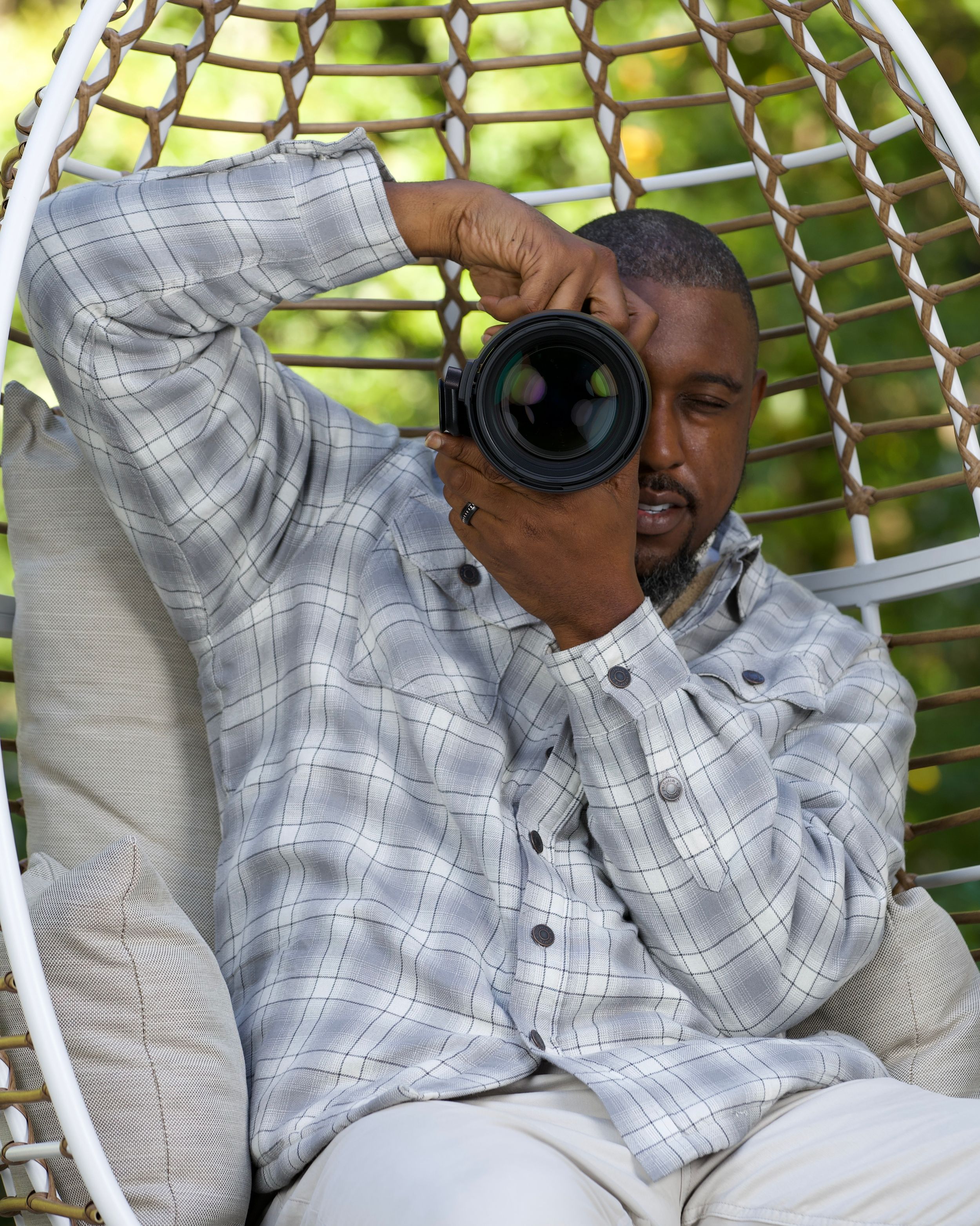 Casual portrait in a comfortable outdoor chair with natural lighting. | Shot By Lo™