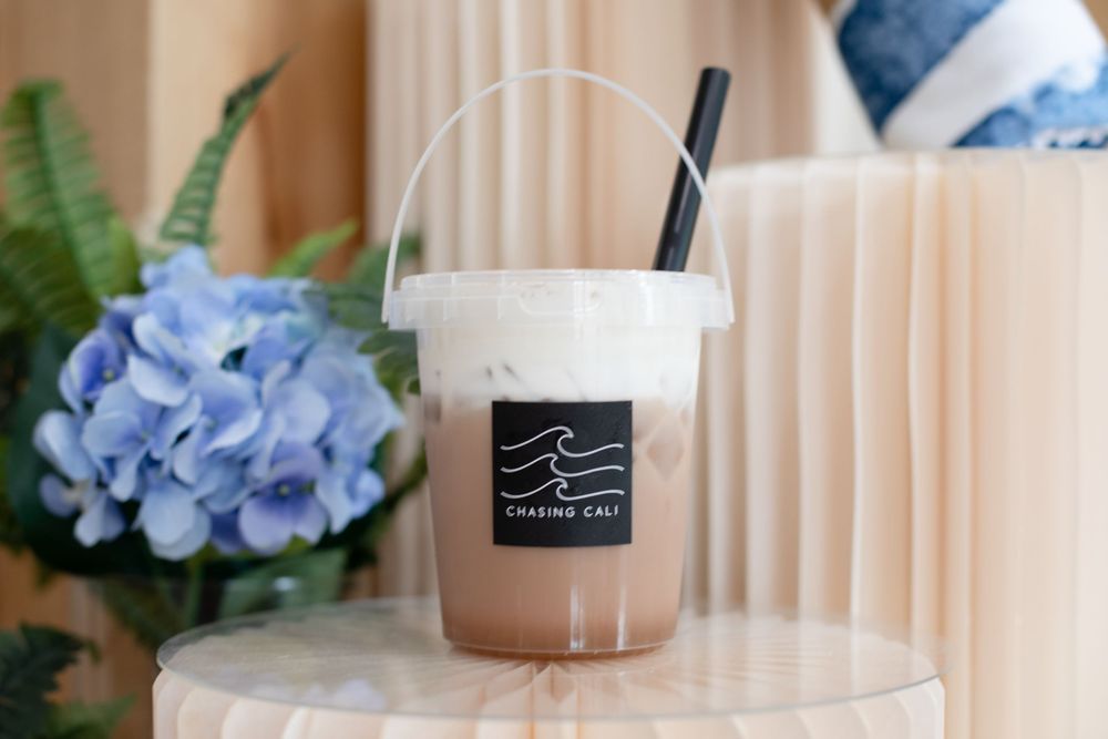 Bucket of Coffee branding announcement at Chasing Cali Collective Cincinnati with modern café aesthetic