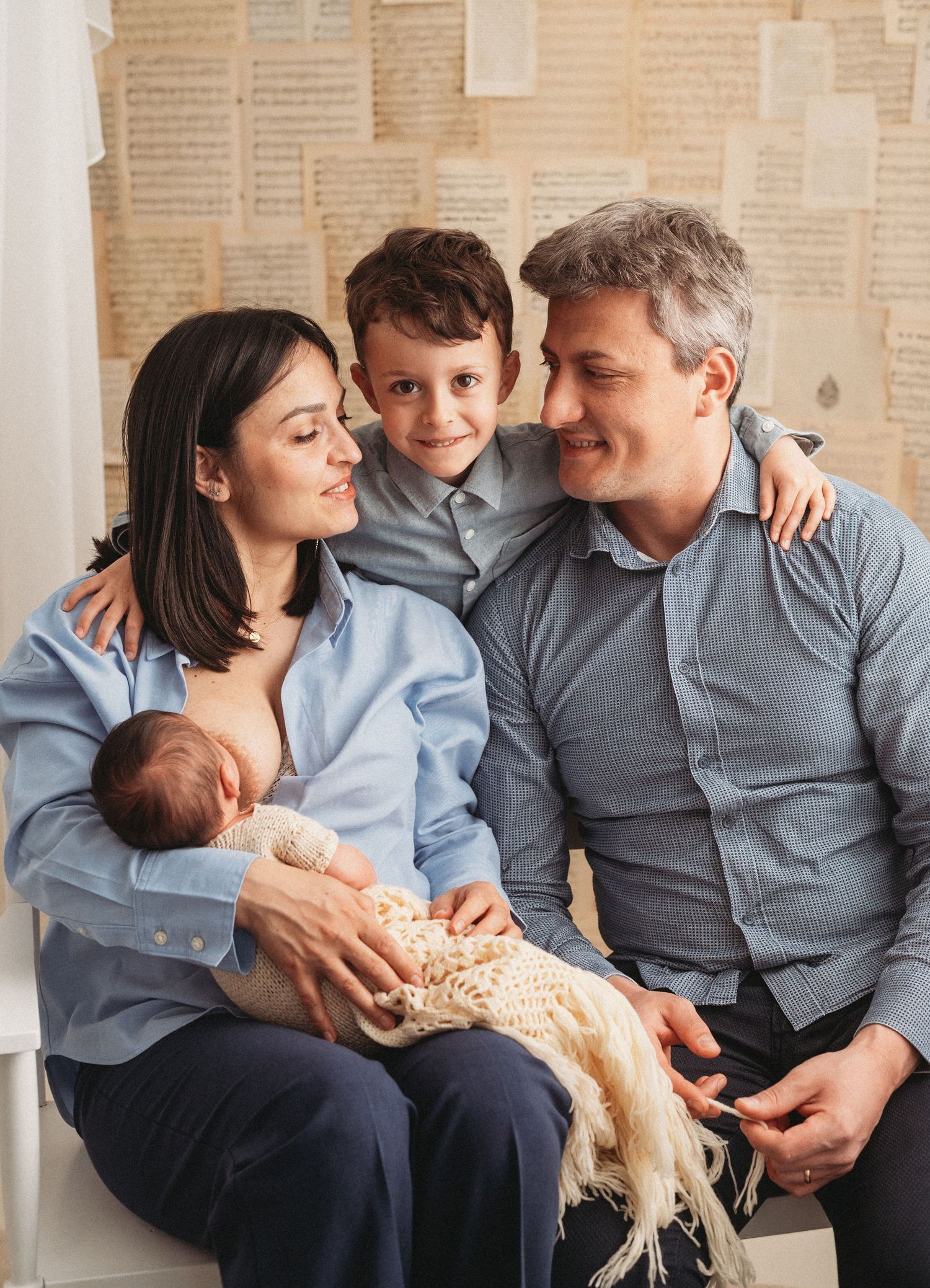 A family sits together on a couch in a heartwarming sequence of four connected photos.