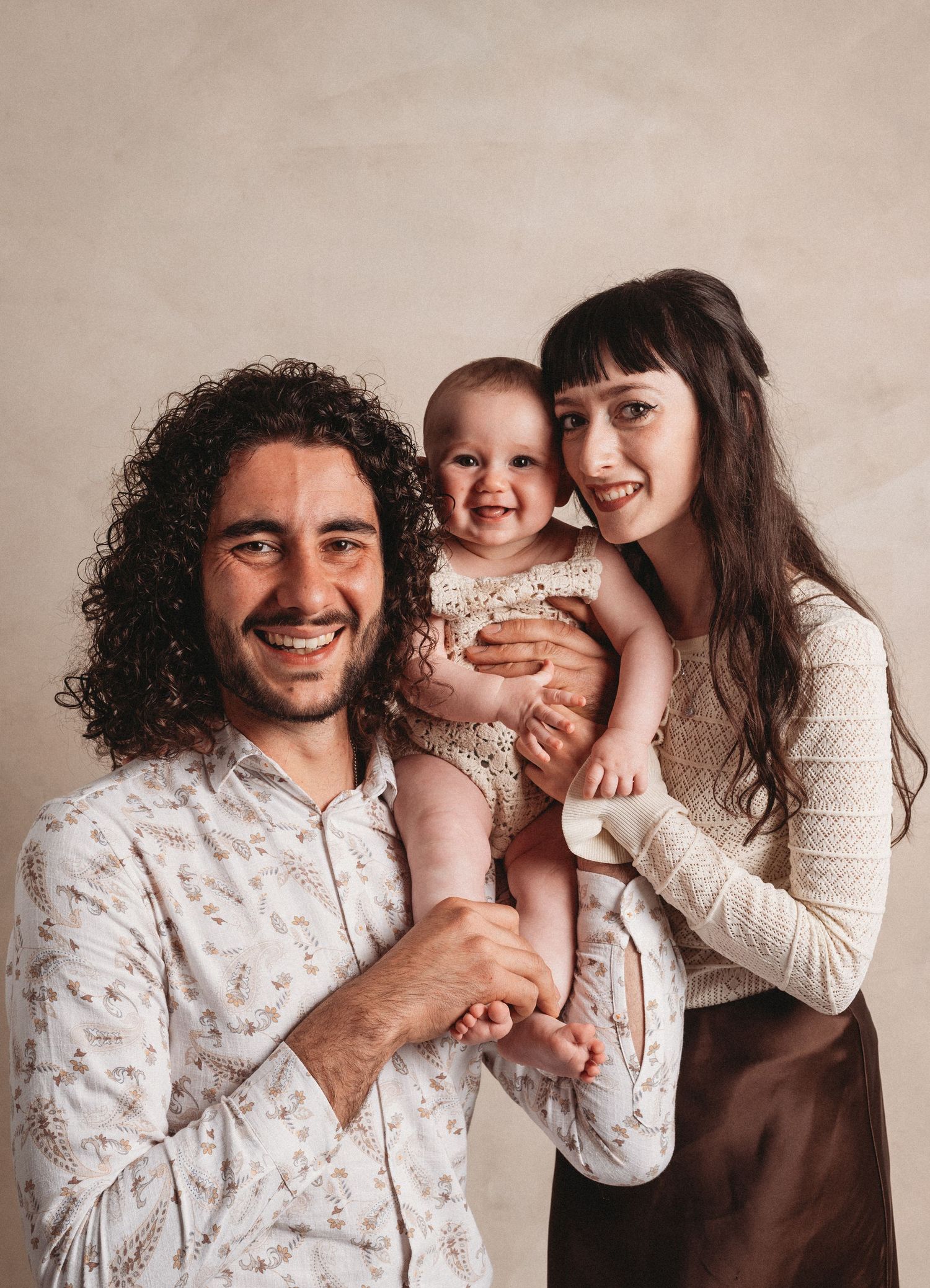 A playful collection of family portraits showing joyful bonding moments against a neutral backdrop.
