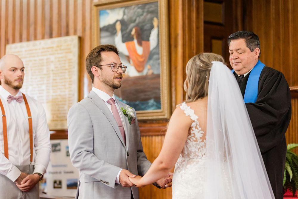 Four wedding images side by side showing romantic moments during a ceremony in an ornate indoor venue.