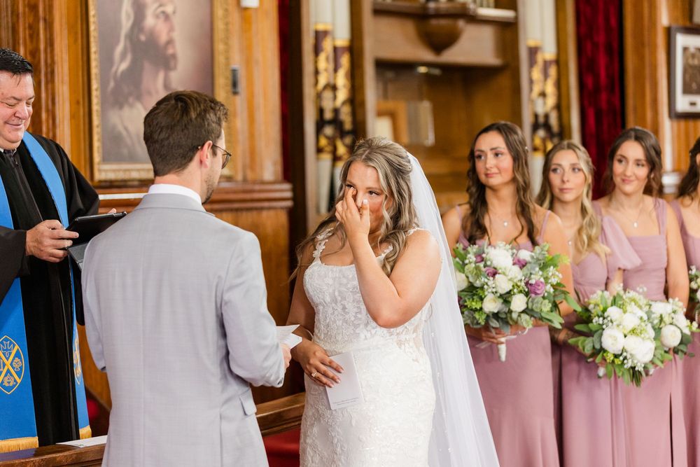 Wedding ceremony moments captured in a series of emotional candid photos inside an elegant wood-paneled venue.