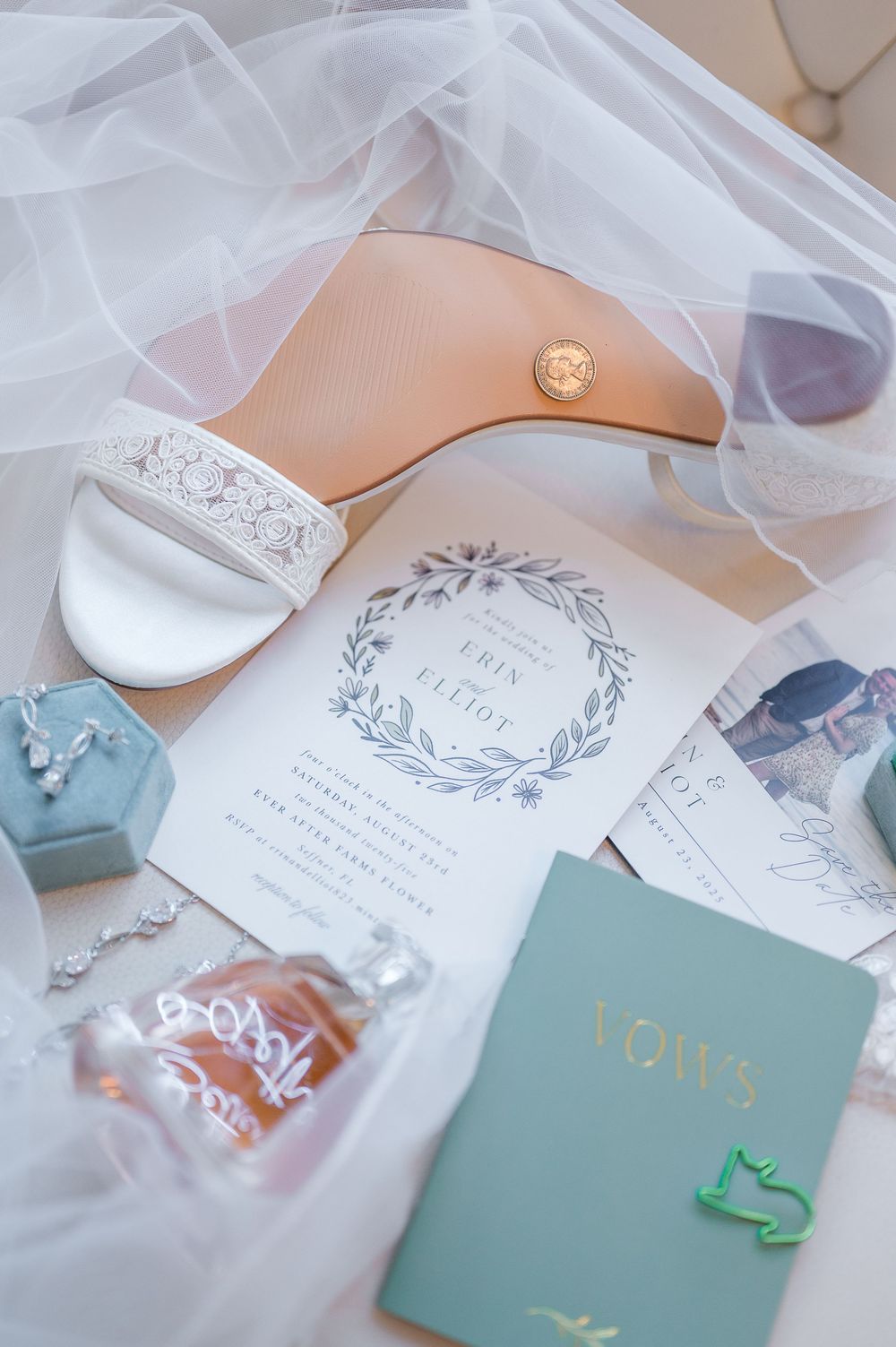 Wedding stationery and invitation suite in mint green and white with delicate lace details and floral designs.