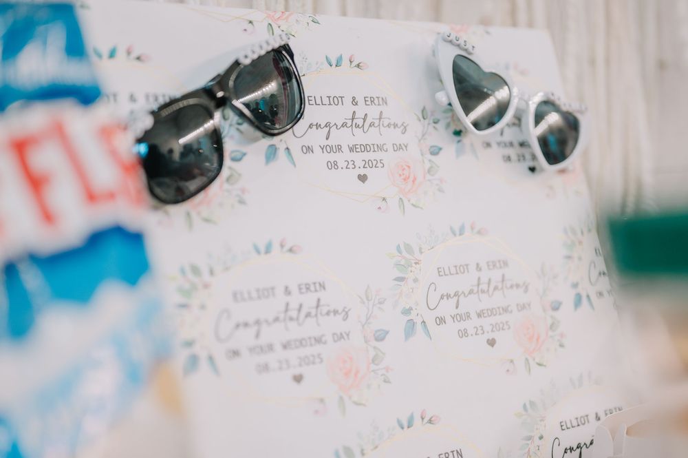 Handwritten wedding guest book messages signed in blue ink on white pages.