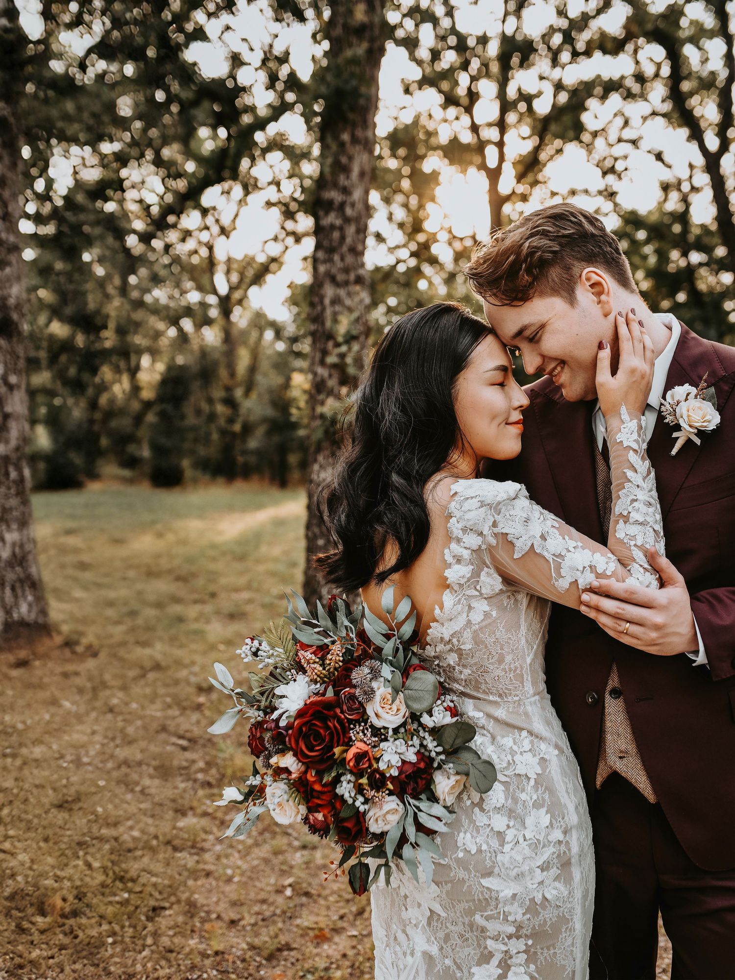 Romantic wedding couple portrait in the woods at sunset