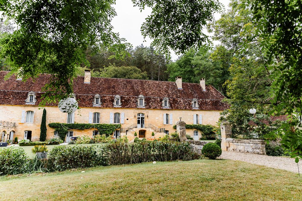 French countryside estate with traditional architecture and well-maintained gardens.