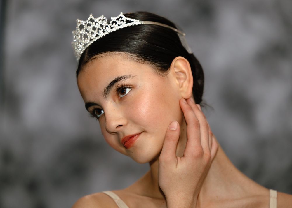 Young ballerina modelling with tiara