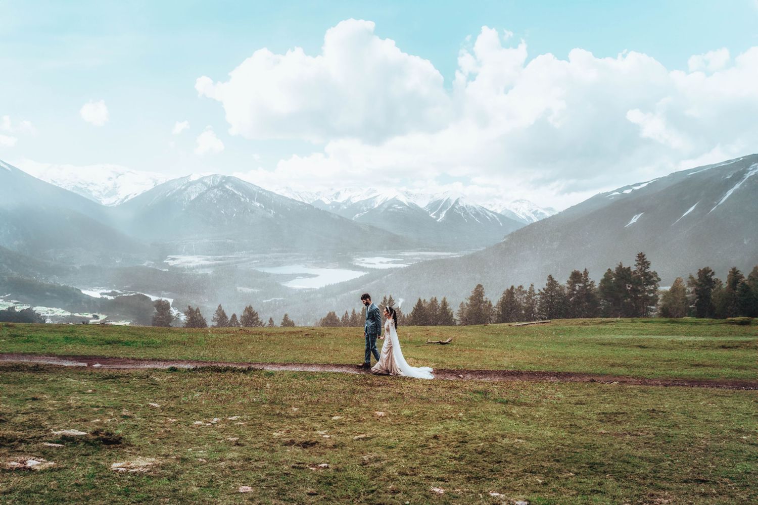 Bride and groom with mountain vista. Banff wedding photography.