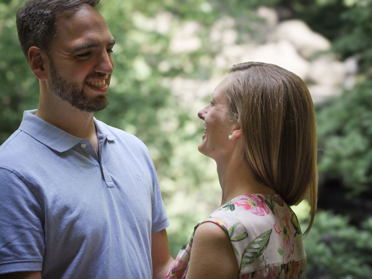 A romantic portrait of a couple in the Ramble, Central Park, as they look at each other with love and warmth.