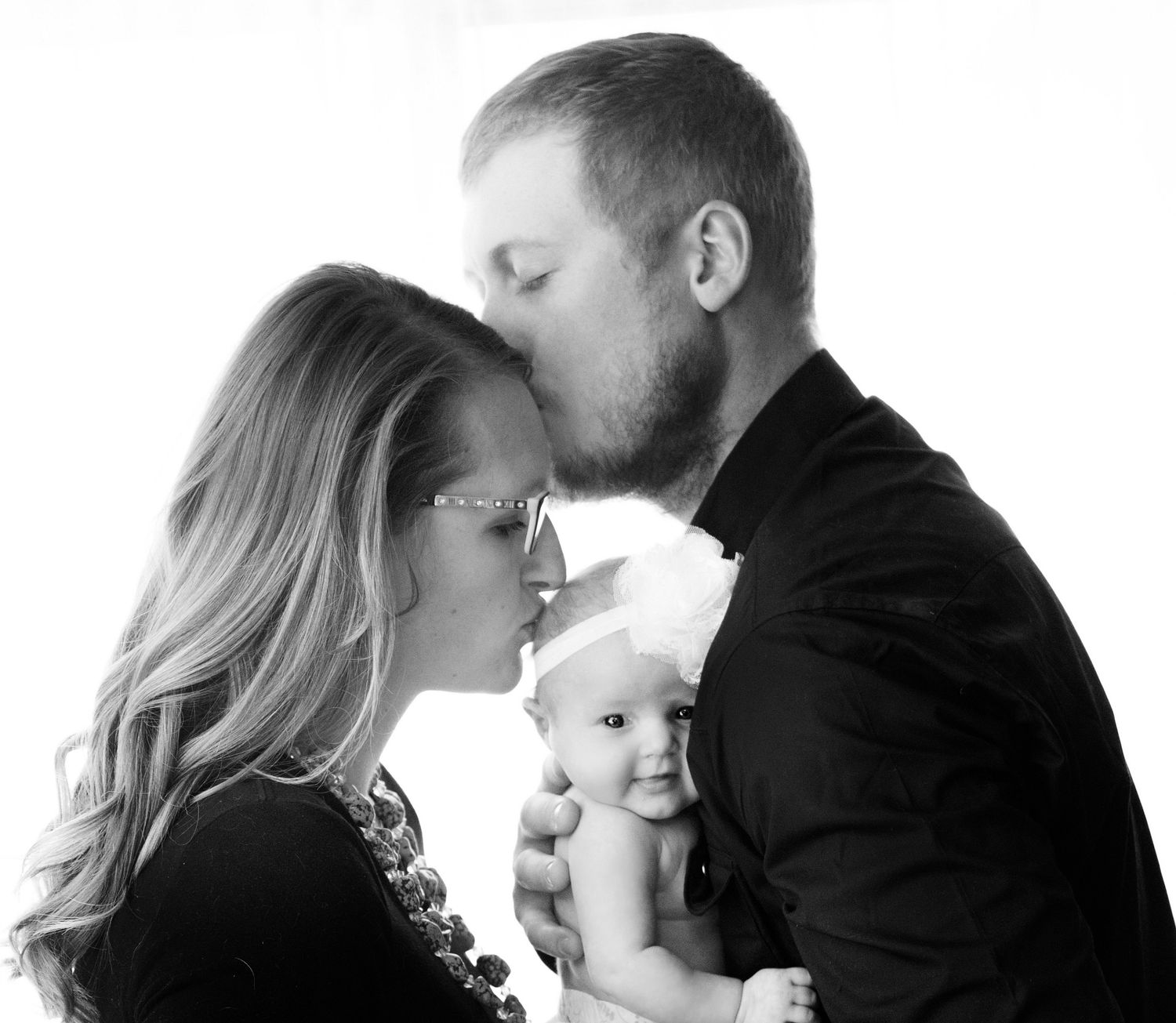 newborn lifestyle photoshoot of baby girl in her crib. Greeley colorado new born photography