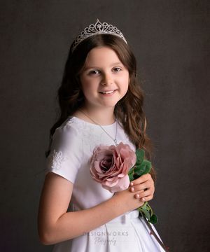 A series of four portrait photos showing someone in a white dress wearing a tiara and holding a pink rose against a dark background.